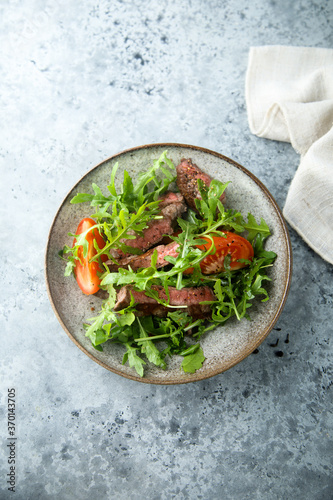 Arugula salad with grilled beef steak
