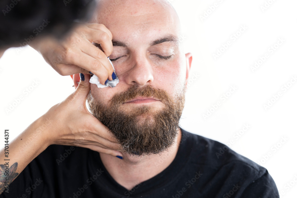 a man whose face makeup is removed a man whose face makeup is removed