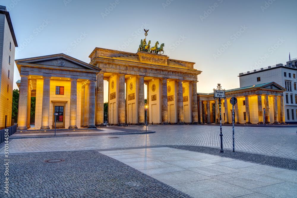 The famous illuminated Brandenburg Gate in Berlin at sunset with no people