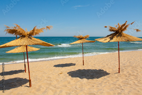 Fototapeta Naklejka Na Ścianę i Meble -  Umbrellas on the beach, St. Constantine and Helena resort, Varna province, Bulgaria