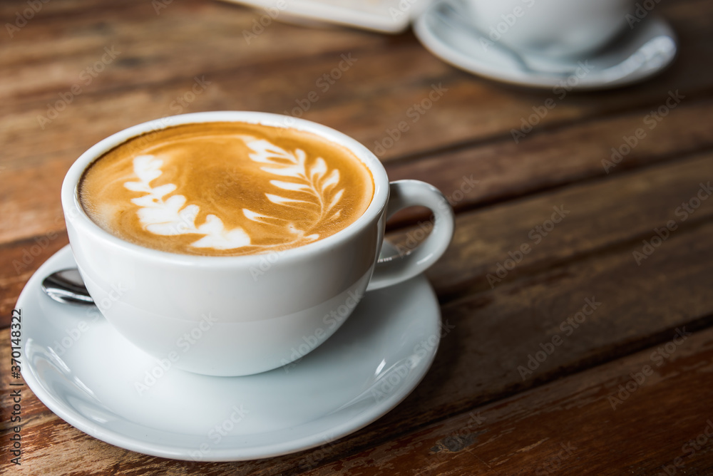 Hot coffee latte with beautiful latte art, close up and selective focus image. Hot coffee latte with beautiful latte art, close up and selective focus image.