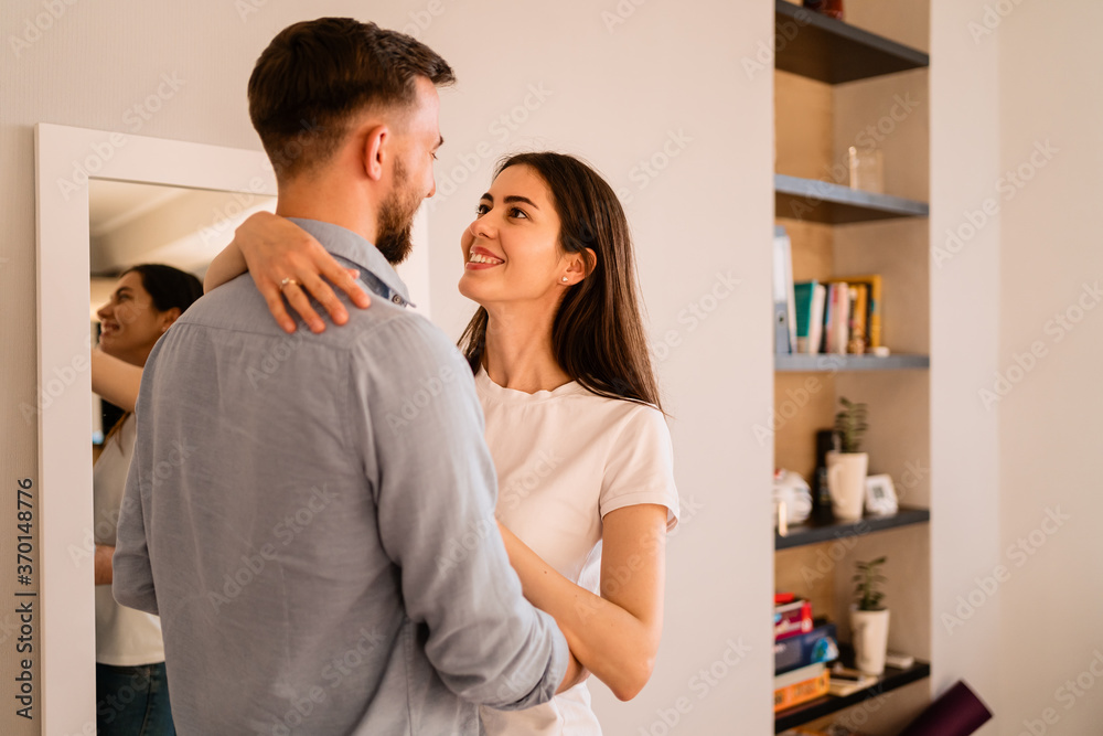 Portrait lovely couple hugging each other, smiling, enjoying time together Portrait lovely couple hugging each other, smiling, enjoying time together