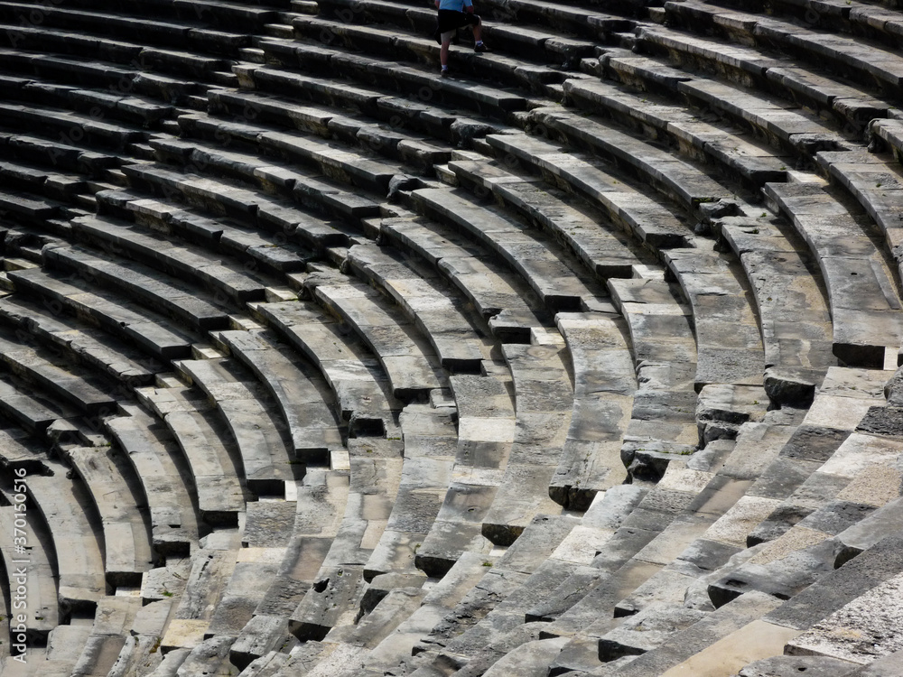 stone seats in a ancient amphitheater stone seats in a ancient amphitheater