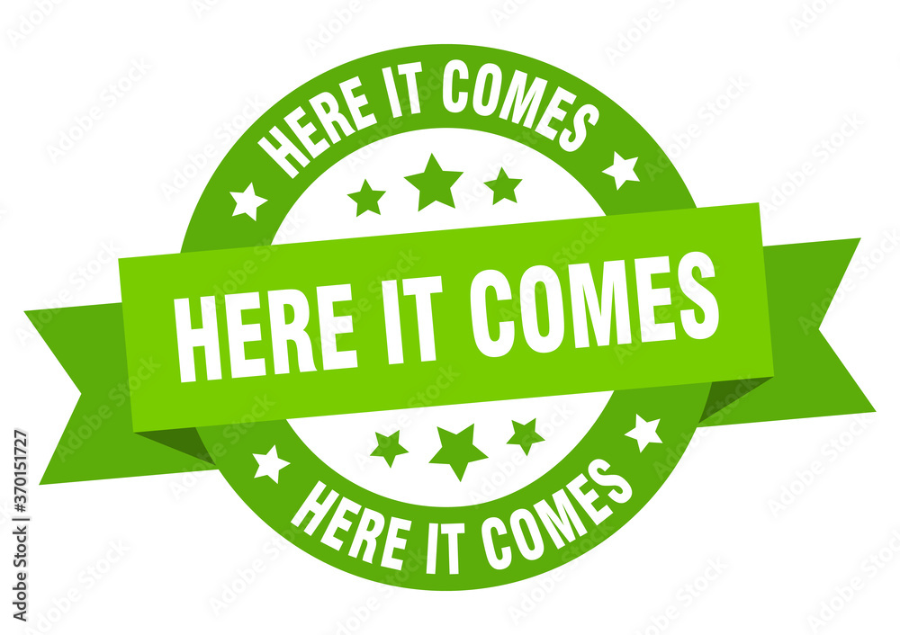 here it comes round ribbon isolated label. here it comes sign here it comes round ribbon isolated label. here it comes sign
