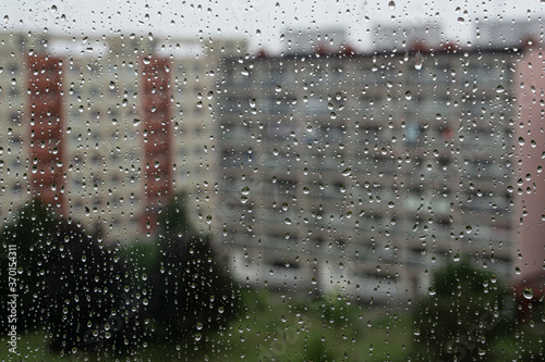 Courtyard in the rain seen through the rain drops