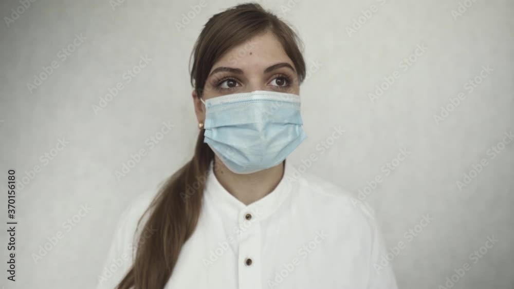 Female doctor during a coronavirus pandemic covid-19. Close portrait of a tired doctor Female doctor during a coronavirus pandemic covid-19. Close portrait of a tired doctor