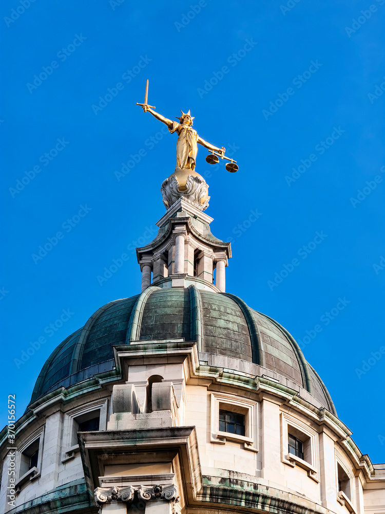 Scales of Justice of the Old Bailey Central Criminal Court London England UK where criminals of major crimes represented by a barrister if guilty face justice and is a popular travel destination