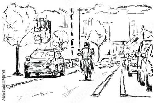 A motorcyclist rides the streets of a big city