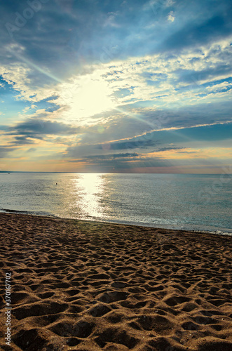 Beach of Black Sea from Golden Sands, Bulgaria with golden sands, blue clear water, fluffy clouds sky, sunrise