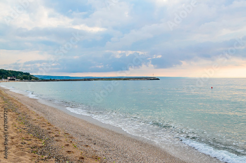 Beach of Black Sea from Golden Sands  Bulgaria with blue clear water  fluffy clouds sky  hotels