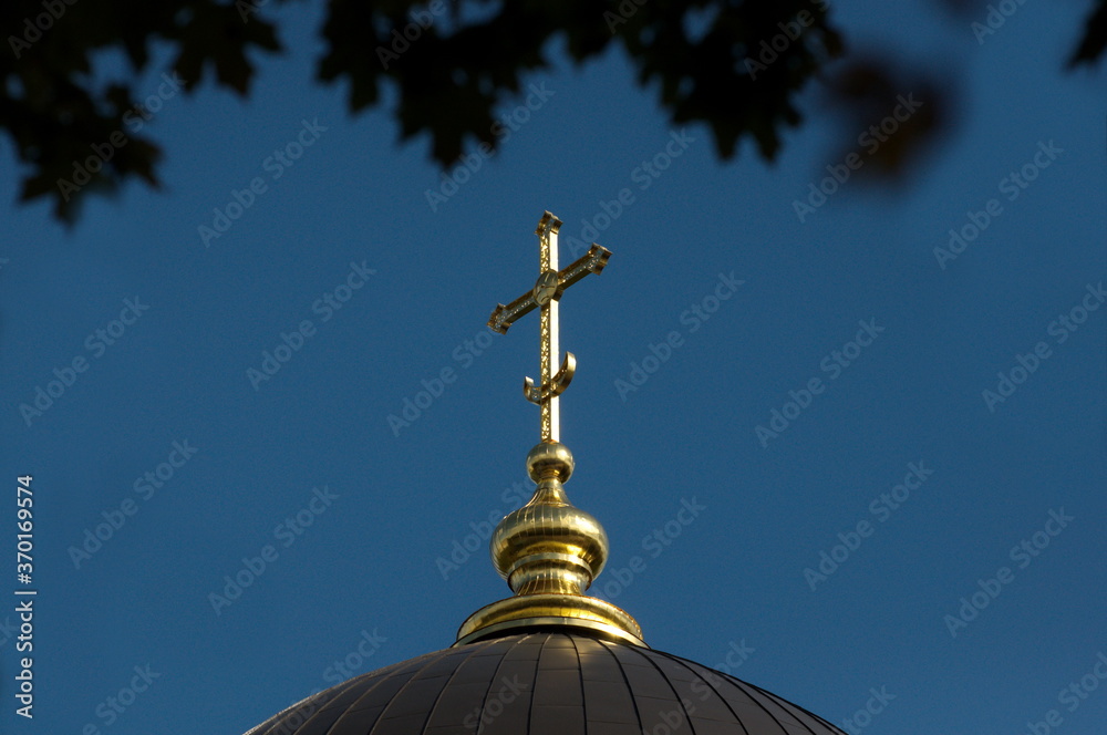 Ramenskoe. Moscow region. Russia. September 21.2019. Cross on Orthodox Church glistens in the morning sun. Ramenskoe. Moscow region. Russia. September 21.2019. Cross on Orthodox Church glistens in the morning sun.