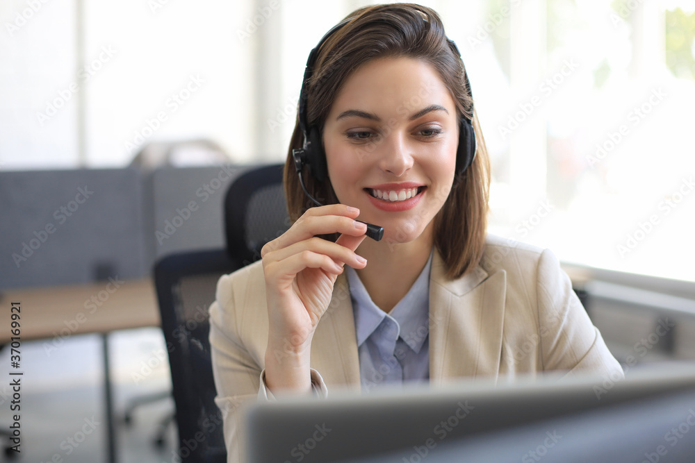 Woman customer support operator with headset and smiling. Woman customer support operator with headset and smiling.