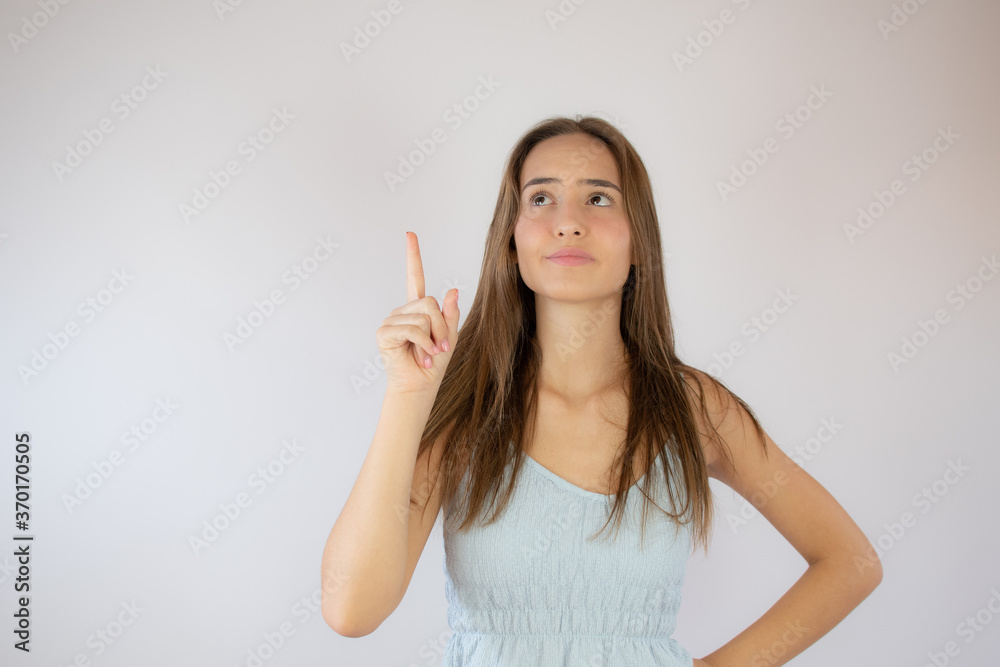 Pretty young girl making finger up gesture Pretty young girl making finger up gesture