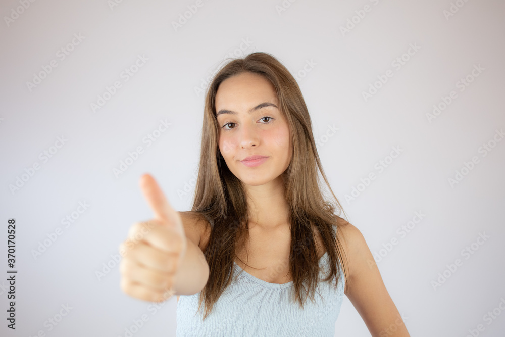 Pretty young girl making the finger up gesture Pretty young girl making the finger up gesture