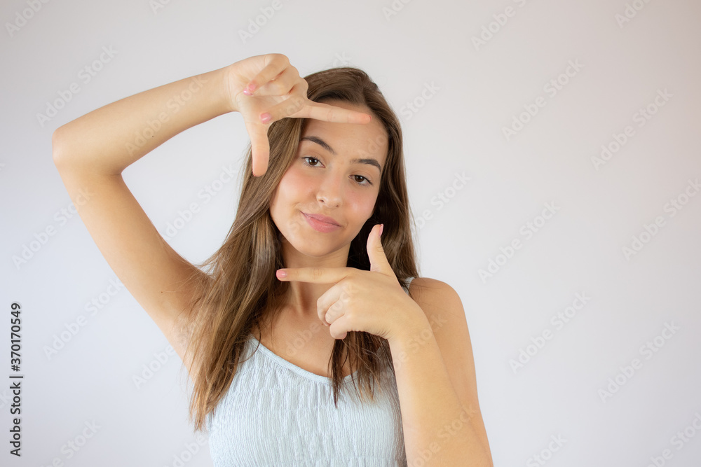 Pretty young girl making the portrait gesture Pretty young girl making the portrait gesture