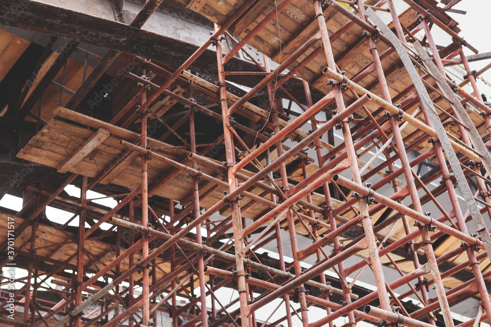 Obraz premium Supporting scaffold construction. Renovation of old bridge