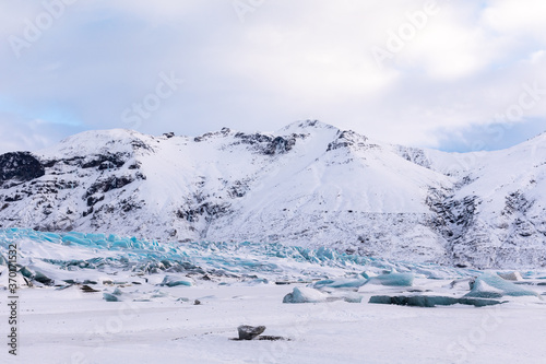 Winter Panorama of Icelandic mountains, glacier and Vatnajökull National Park clouds