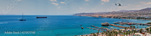 Panorama of central public beach in Eialt - Israeli southernmost tourist and resort city, located on the northern shores of the Red Sea, concept of blissful vacation