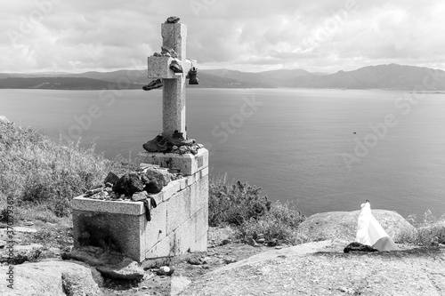 Fisterra, Spain. The cross at Cabo Finisterre (Cape Finisterre), final point of the Way of St James (Camino de Santiago) photo