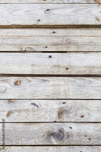 Background gloomy charred wooden fence in dark colors