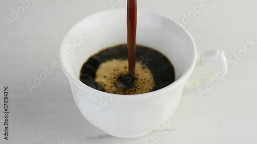 Freshly brewed hot coffee served in a white coffee cup