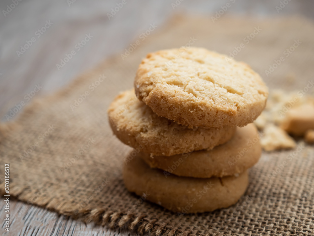 Stacked biscuit sweet cookie on rustic wooden table Stacked biscuit sweet cookie on rustic wooden table