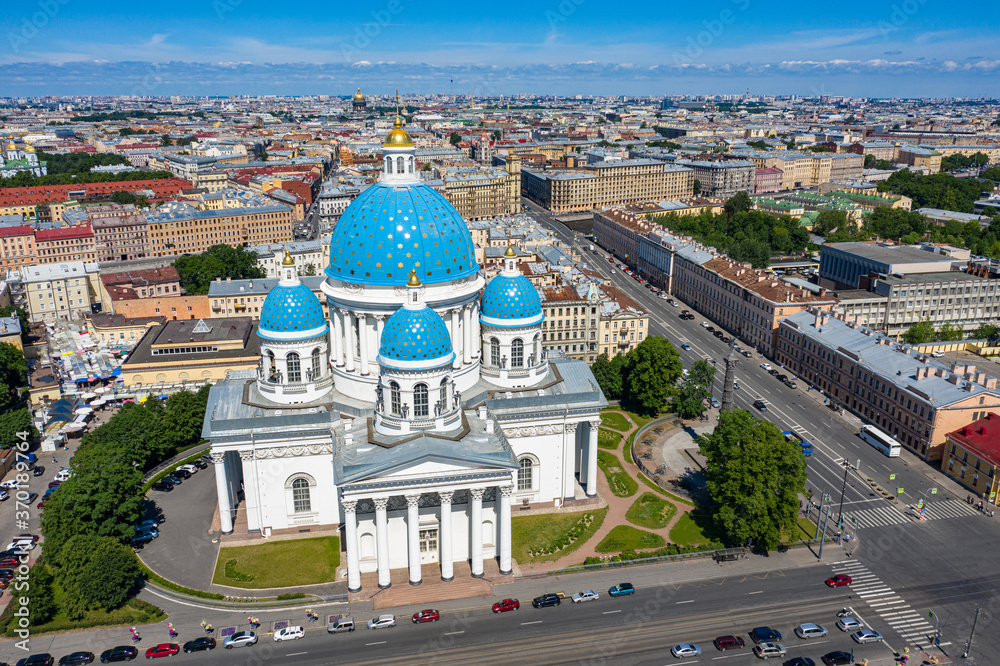 Obraz premium Saint Petersburg from a height. Russia. View of the Trinity Cathedral from a drone. Cathedrals Of St. Petersburg. Trinity Cathedral on a summer day. White Church with blue domes.