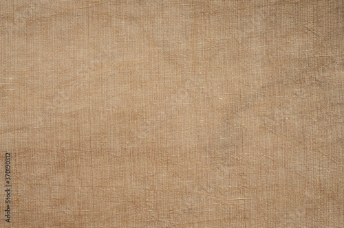 Brown linen and silk fabric texture closeup as fabric background