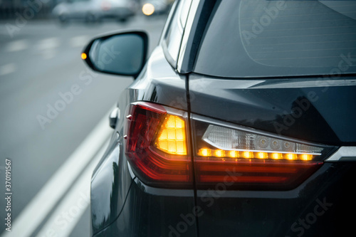 Rear Stop Light Of Large Suv Black Car