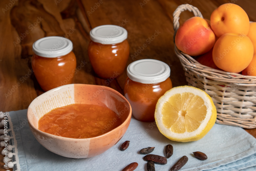 homemade apricot lemon jam. basket with apricots, a lemon and tonka beans. homemade apricot lemon jam. basket with apricots, a lemon and tonka beans.