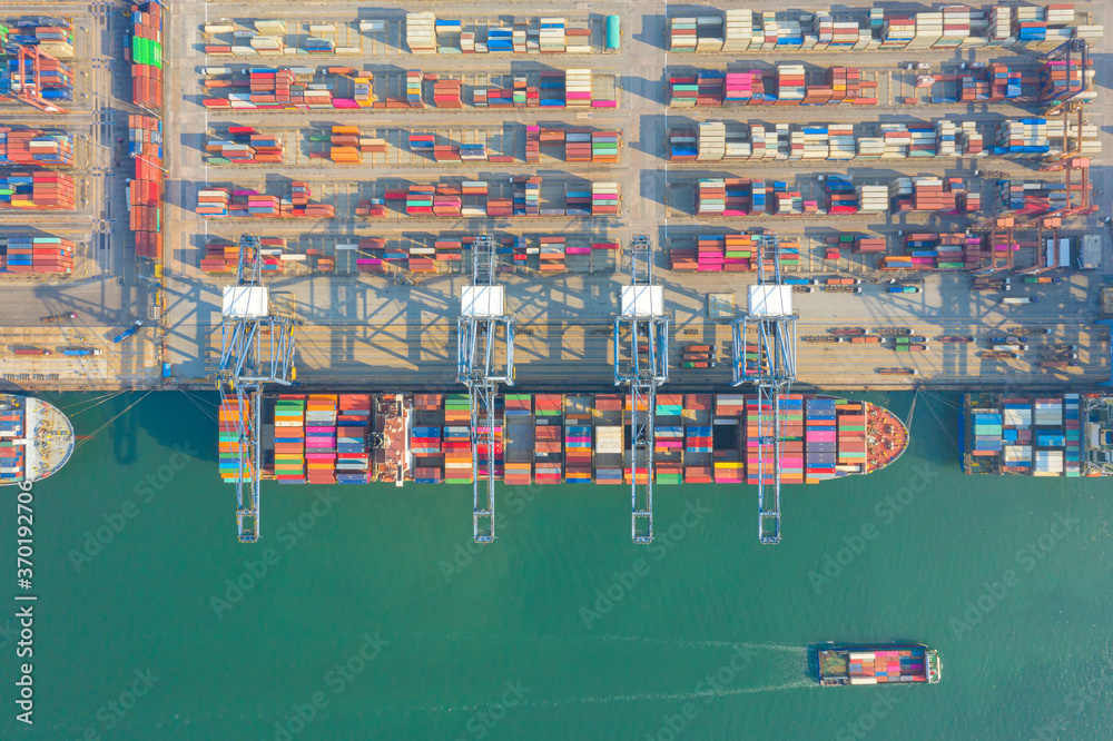 Container , container ship in export and import business and logistics. Shipping cargo to harbor by crane. Water transport International. Aerial view and top view