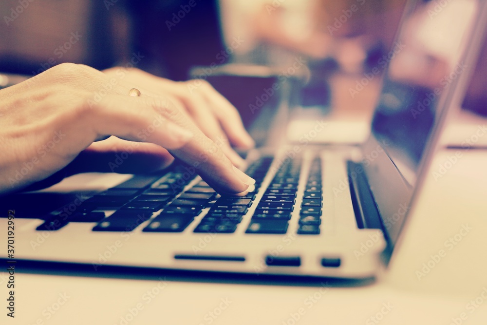 typing on a laptop keyboard typing on a laptop keyboard