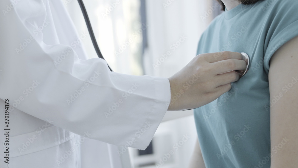 close up of a female doctor holding a stethoscope close up of a female doctor holding a stethoscope