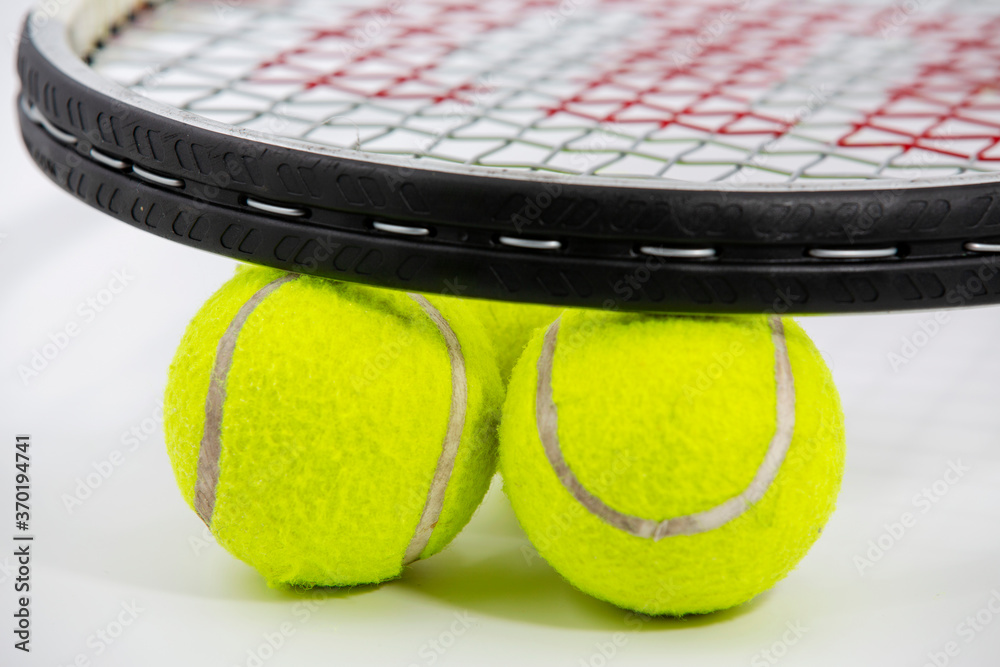 Sport. Tennis racket and ball. Isolated on the white background