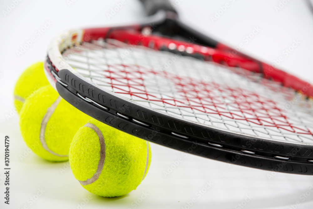 Sport. Tennis racket and ball. Isolated on the white background