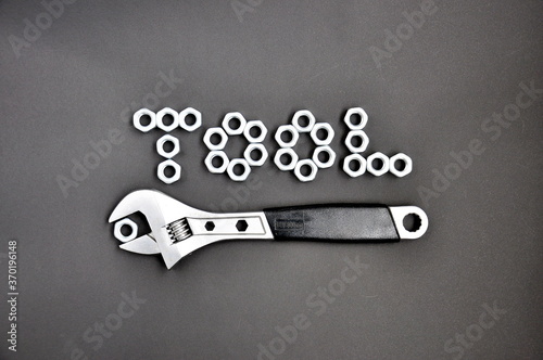 Wrench with nuts and an inscription 