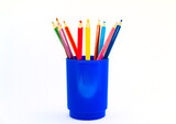 Colored pencils in a glass isolated on a white background