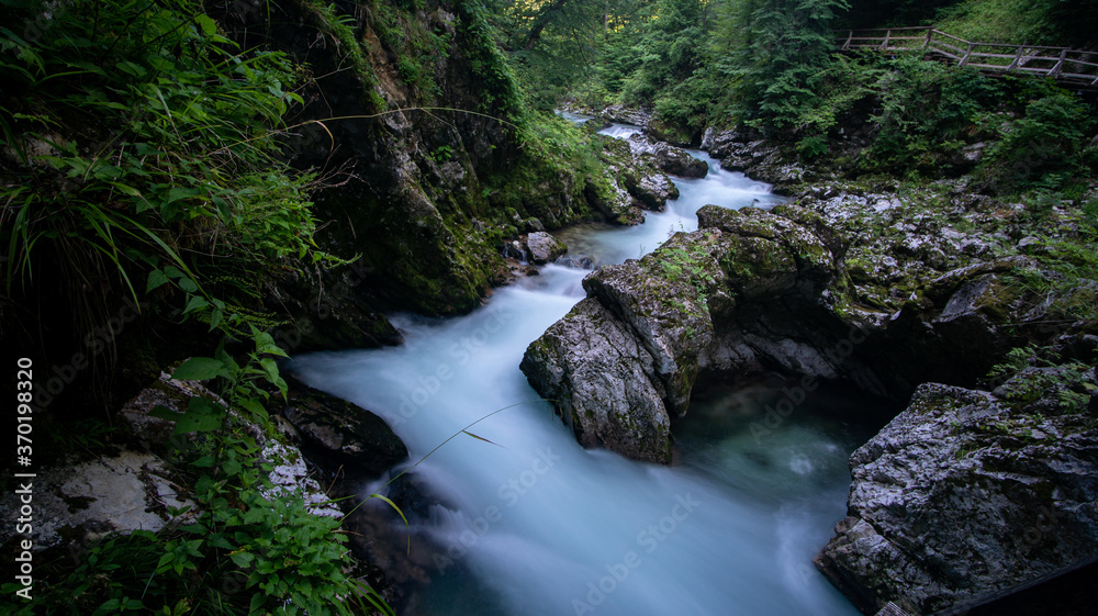 Vintgar Gorge in Slovenia, view of the river and waterfall in the green. 