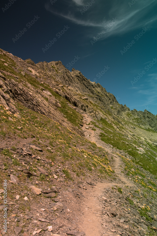 The path to the mountains in summer season The path to the mountains in summer season