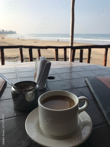 cup of coffee on the beach
