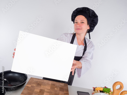Female chef with a blank sh...