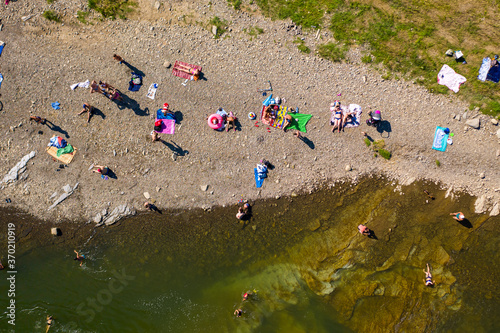 Skole Beskids National Nature Park. View from drone on people on Opir river beach  embankment
