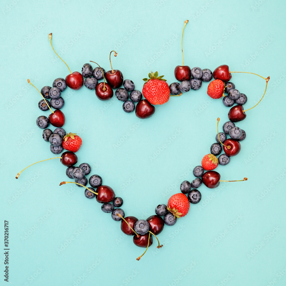 Obraz premium Different berries photography , heart shape