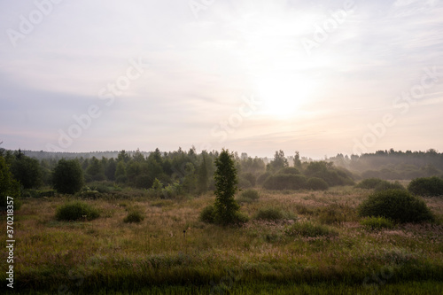 Wallpaper Mural sunrise in the morning in a haze of fog over buildings, trees and fields Torontodigital.ca