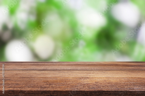 Wooden beautiful table on blurred bokeh background