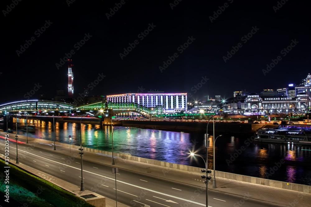 Beautiful embankment of the river at night in the city. Moscow, Russian Federation, 08.08.2020 Beautiful embankment of the river at night in the city. Moscow, Russian Federation, 08.08.2020