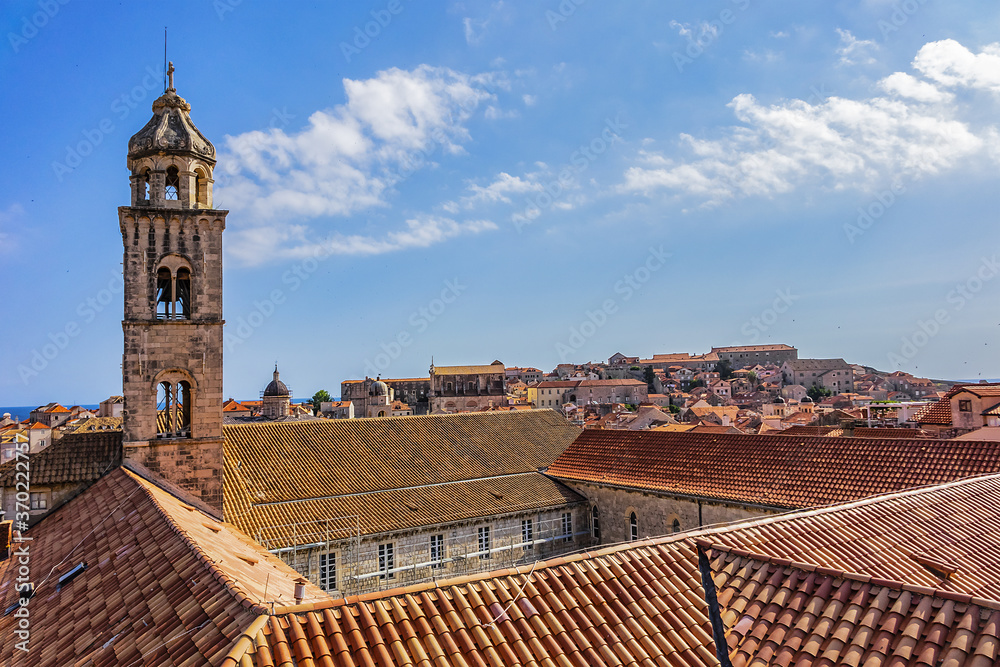 Church tower of Dominican Monastery (Dubrovnik Dominikanski Samostan, 1225) and the orange-tiled roofs of old town. Dubrovnik, Mediterranean, Croatia.