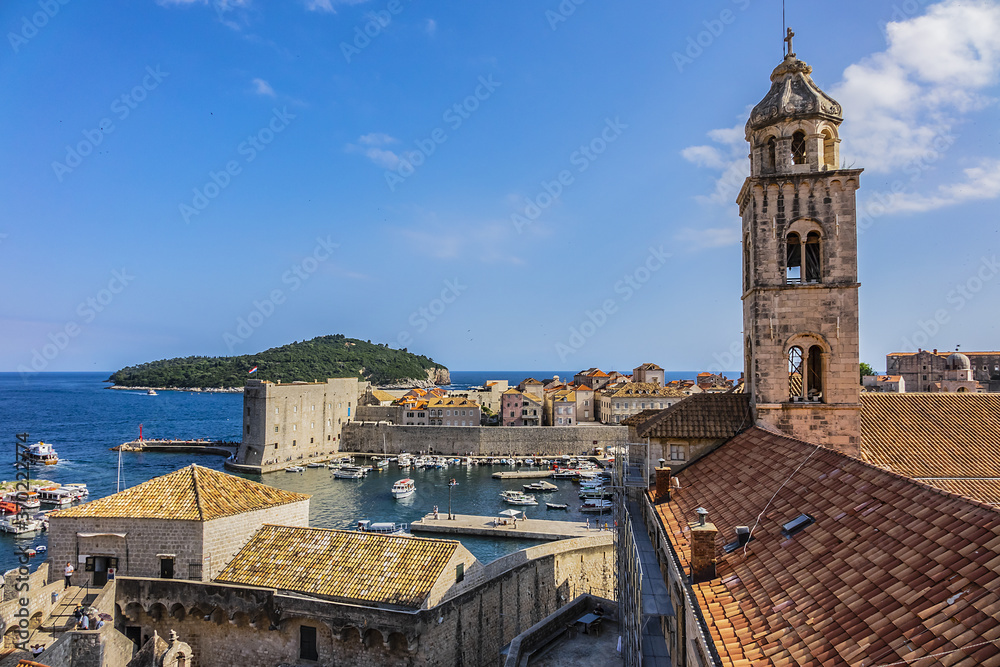 Church tower of Dominican Monastery (Dubrovnik Dominikanski Samostan, 1225) and the orange-tiled roofs of old town. Dubrovnik, Mediterranean, Croatia.
