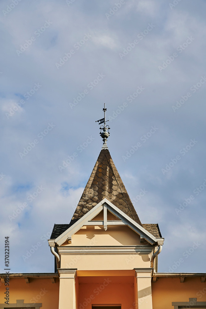 View to the small tower of a house in the small Baltic Sea town of Bansin on the island Usedom in Germany. View to the small tower of a house in the small Baltic Sea town of Bansin on the island Usedom in Germany.