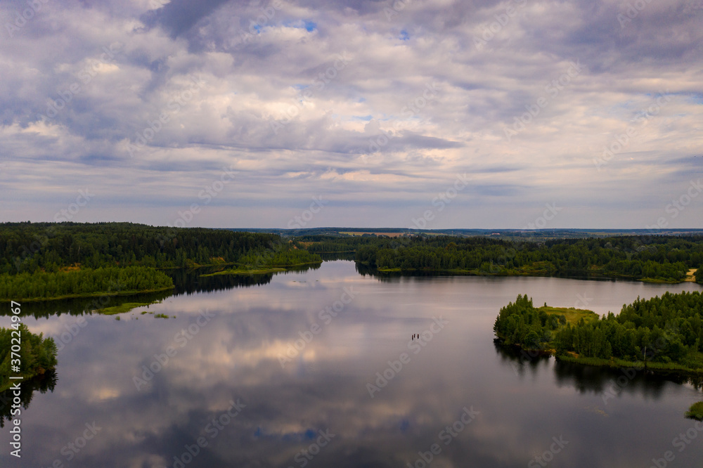 panoramic landscape of lake and forest around in summer at dawn filmed from a drone panoramic landscape of lake and forest around in summer at dawn filmed from a drone